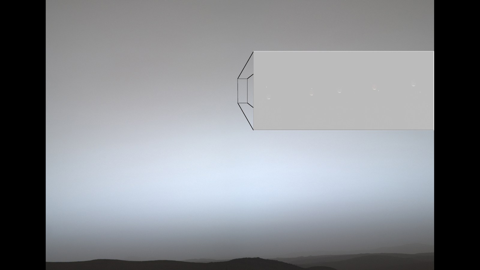 NASA composite showing pixel-size Earth moving behind crescent Phobos in the Martian sky