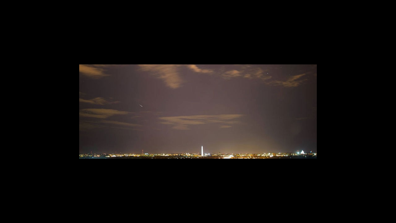 Several Perseid meteors crossing a dark sky